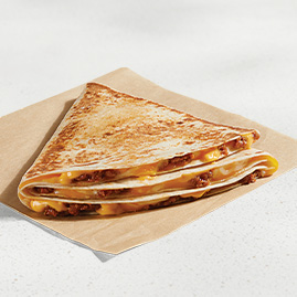 A Stacker featuring layers of seasoned beef, melted cheese, and soft tortillas.