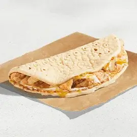A 3 Cheese Chicken Flatbread Melt featuring grilled chicken, three types of melted cheese, and a warm flatbread.