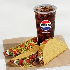 A 3 Crunchy Tacos Supreme® Combo featuring three Supreme tacos, nacho chips, and a drink.
