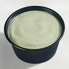 A packet of Avocado Ranch Sauce, featuring a creamy blend of ranch and avocado for a smooth, tangy, and slightly buttery flavor.