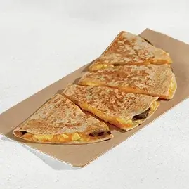 A Breakfast Quesadilla filled with steak, eggs, and cheese.