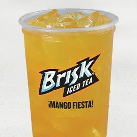 A cold cup of Brisk® Mango Fiesta, highlighting the bold flavor of ripe mango perfectly blended with refreshing iced tea.
