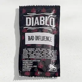 A packet of Taco Bell's Diablo Sauce, delivering an intense and fiery heat with a bold, smoky flavor.