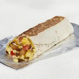 A Grande Toasted Breakfast Burrito filled with bacon, eggs, cheese, and potatoes in a toasted tortilla.