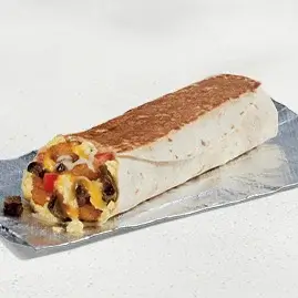 A Grande Toasted Breakfast Burrito filled with steak, eggs, cheese, and potatoes in a toasted tortilla.