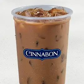 A tall cup of Iced Cinnabon Delights® Coffee, served cold over ice and blended with the sweet flavors of cinnamon and icing.