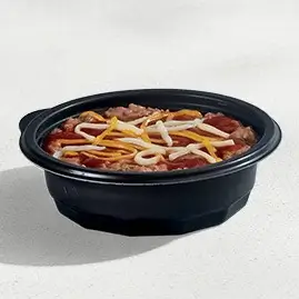 A bowl of seasoned  Pintos N Cheese with beans, red sauce, and melted cheese.