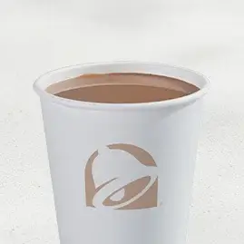 A steaming cup of Taco Bell's Premium Hot Coffee, full of rich aroma.