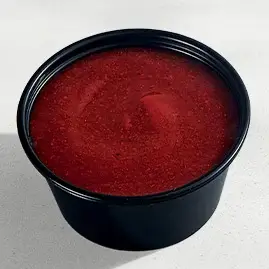 A jar of homemade red sauce, rich and savory, ideal for adding a burst of flavor to your favorite pasta or pizza.