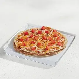 A Veggie Mexican Pizza topped with beans, tomatoes, cheese, and a crispy tortilla base.
